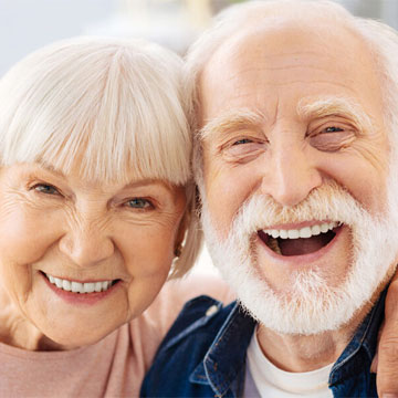 a smiling old couple